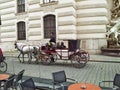 Two men enjoy a trip on ViennaÃ¢â¬â¢s fiacre Royalty Free Stock Photo